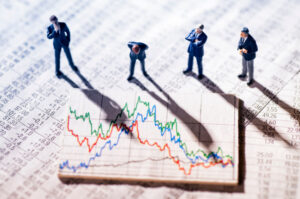 A vector representation of group of people standing on a stock market graph and watching.