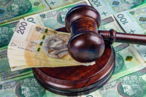 A gavel on top of money.